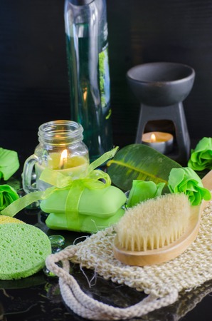 Soap and a variety of accessories for a spa on a black backgroundの写真素材