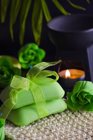 Soap and a variety of accessories for a spa on a black backgroundの写真素材