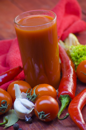 sharp vegetable juice and vegetables on a wooden tableの写真素材
