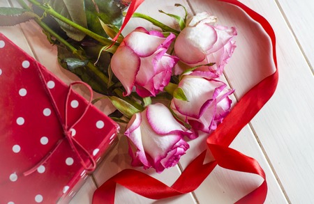 flowers roses and a gift for a girlの写真素材