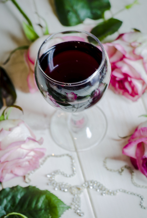 romantic and beautiful background for postcard wine and flowersの写真素材