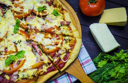 Pizza with salami mushrooms and mozzarella Italian-style home-madeの写真素材