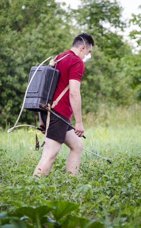 spraying people with potato poison from beetles. Farmer.の写真素材