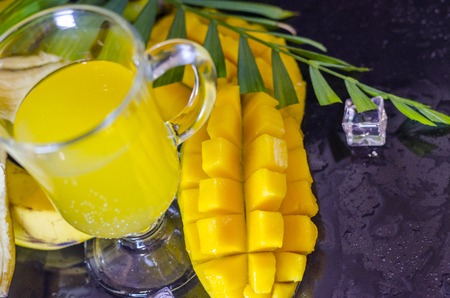 ripe mango on the table close up