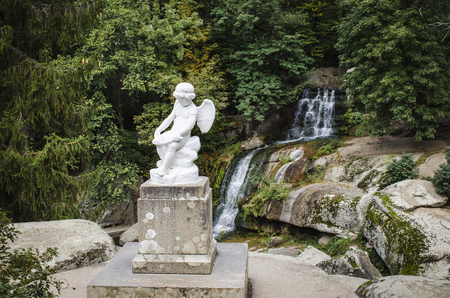 statues in a public park in the fallの写真素材