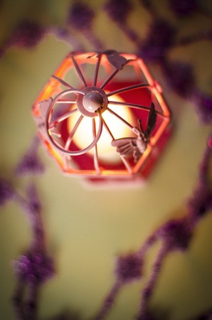 New Year and Christmas decoration with decorations and a candle lamp in pink colorの写真素材