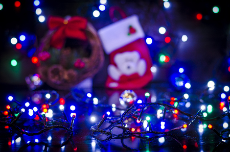 Christmas background, garland lights, holiday toys in blueの写真素材