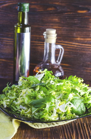 dietary green spinach and arugula salad in a bowlの写真素材