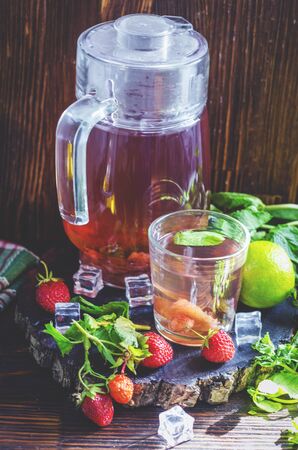 strawberry compote with mint and lime, refreshing drink homemade strawberry mahitoの写真素材