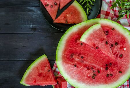 slices of ripe watermelon on the tableの写真素材