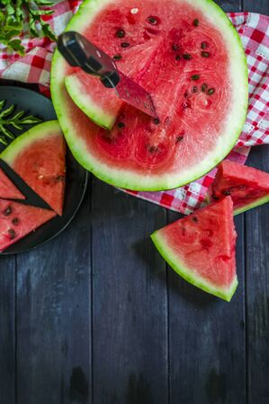 slices of ripe watermelon on the tableの写真素材