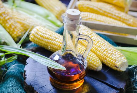 corn oil in a glass bottle and pumped cornの写真素材