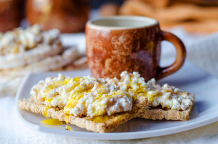 Sandwich with cottage cheese, honey and banana on a dietetic bread. Healthy eating