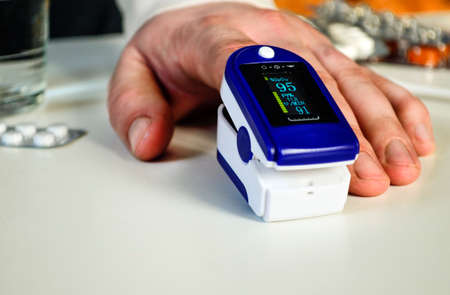 medical monitoring device for non-invasive measurement of oxygen saturation level human finger pulse oximeterの写真素材
