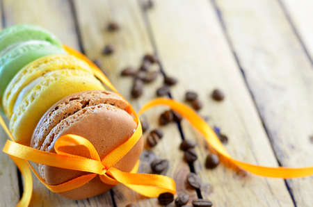 macaroon cookies on wooden background with free space in the frameの写真素材