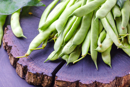 Young green beans, pods of fresh green beans on the tableの写真素材