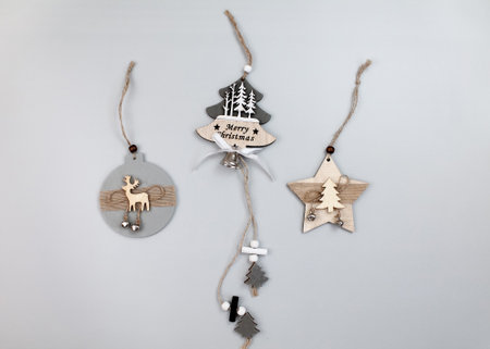 Wooden Christmas decorations on gray background, top view, flat layの写真素材