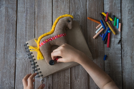 Crayons and kids drawingの写真素材
