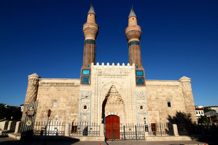 The majestic facade of the GÃ¶k Medrese carved building and mosaic minarets in Sivas in Central Anatolia, Turkeyのeditorial素材