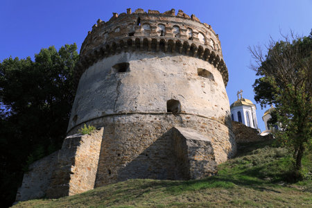 Photo with a view of the Round Tower of the Ostroh Castle in the city of Ostroh, Rivne region,...