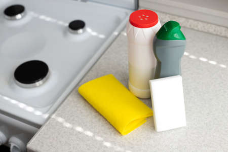 kitchen cleaning products on the table near the gas stoveの写真素材
