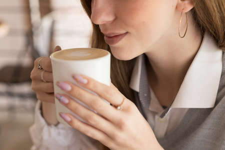 a business woman walks in the park with a notebook. contentの写真素材