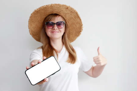 the woman on the window listens to music and drinks tea. meditation at homeの写真素材