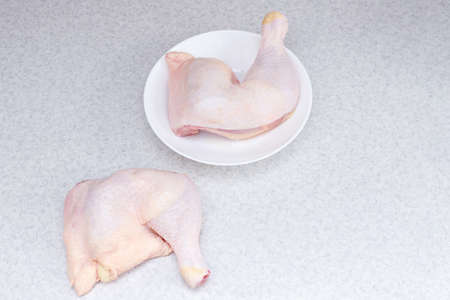 fresh chicken legs on the tableの写真素材