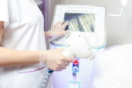 diode laser in the hands of a beautician