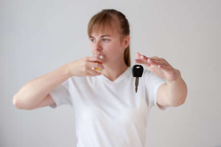 a woman with alcohol suffers close-up. female alcoholismの写真素材