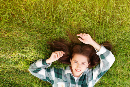 woman smiling on grass top view. bannerの写真素材