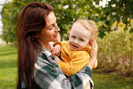 portrait of a mother with a baby on a walk. parenting.の写真素材