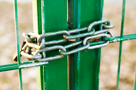 Iron Chain on Metal Gates Outdoorsの写真素材
