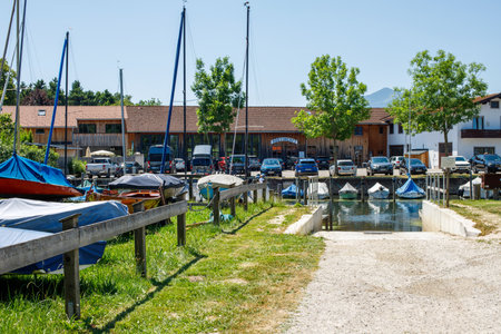 Stunning view of Boat dock with boats on alpine lake in Bavaria, Germanyのeditorial素材