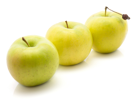 Apples (Smeralda variety) isolated on white background three green yellow in row
の写真素材