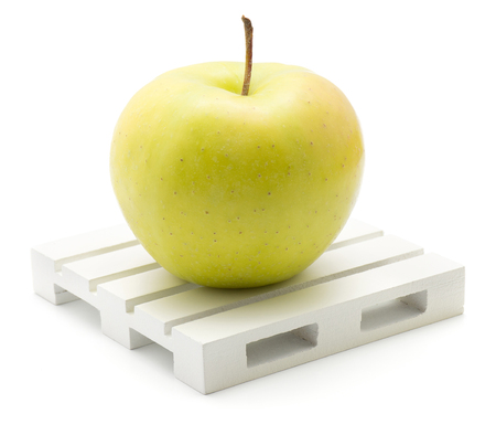 Apple (Smeralda variety) on a pallet isolated on white background one green yellow with blush
の写真素材
