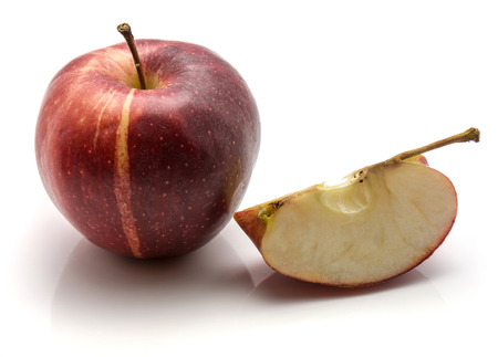 One whole Gala apple and a sliced quarter with a stem isolated on white background
の写真素材
