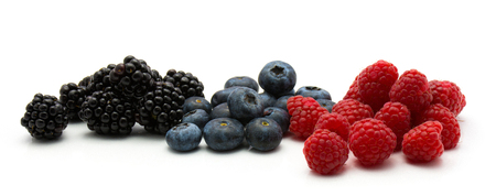 Berries isolated on white background three separated heaps of blackberry blueberry and raspberry
の写真素材