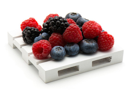 Berries on pallet isolated on white background blackberry blueberry and raspberry
の写真素材