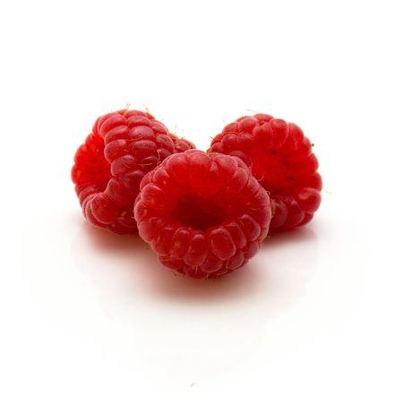 Three red raspberries isolated on white background
の写真素材