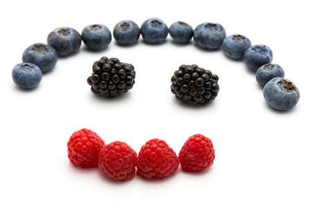 Heart by berries isolated on white background blackberry blueberry and raspberry
の写真素材
