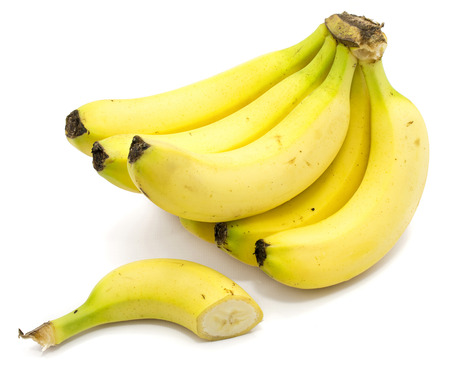 Yellow whole banana cluster with banana half isolated on white background
の写真素材