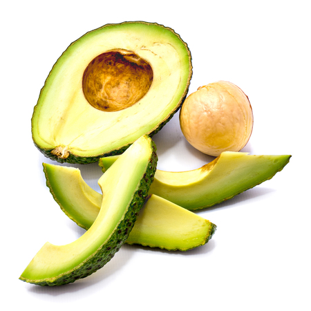 Avocado (Persea americana, alligator pear) slices and one half with a stone isolated on white background
の写真素材