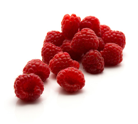 Red raspberries isolated on white background fresh heap