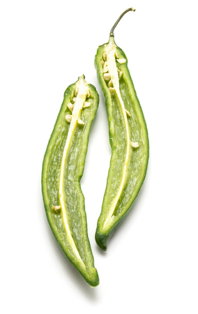 Green Chili pepper, two halves, isolated on white background
の写真素材
