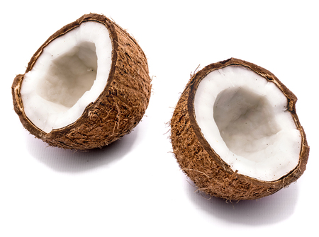 Two cracked coconut halves isolated on white background
の写真素材