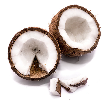 Two coconut halves and meat pieces isolated on white background
の写真素材