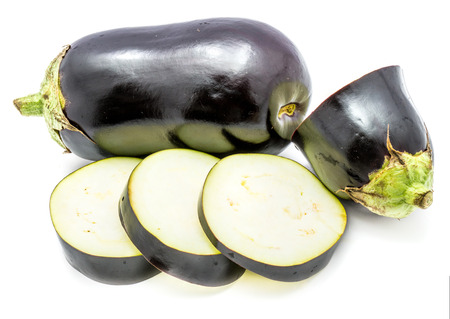 One whole and sliced eggplants (aubergine), round slices, isolated on white background
の写真素材