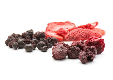 Freeze dried berries mix isolated on white background comparing strawberry cherry bilberry stacks
の写真素材
