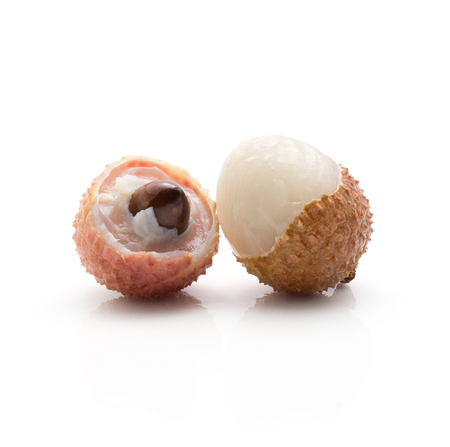 Two peel lychee one with brown seed isolated on white background ripe pink fresh berries
の写真素材